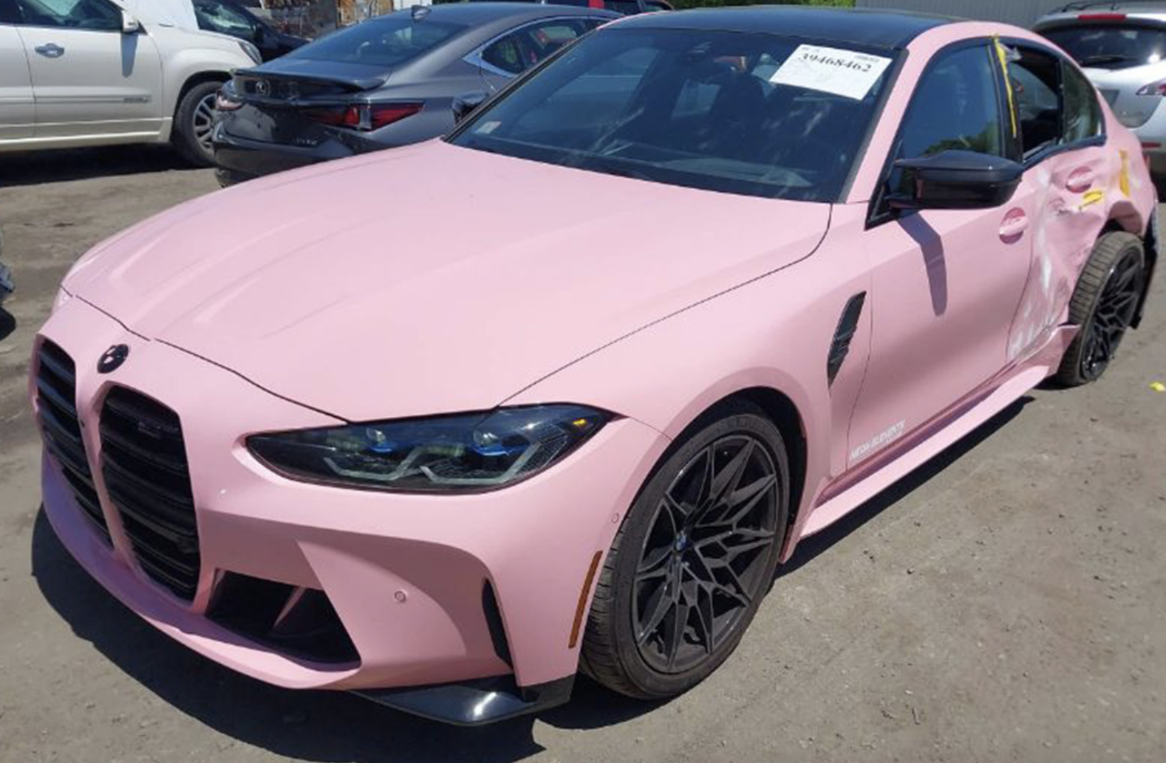 Crashed baby blue and bright pink BMW G80 M3 for sale at auction.