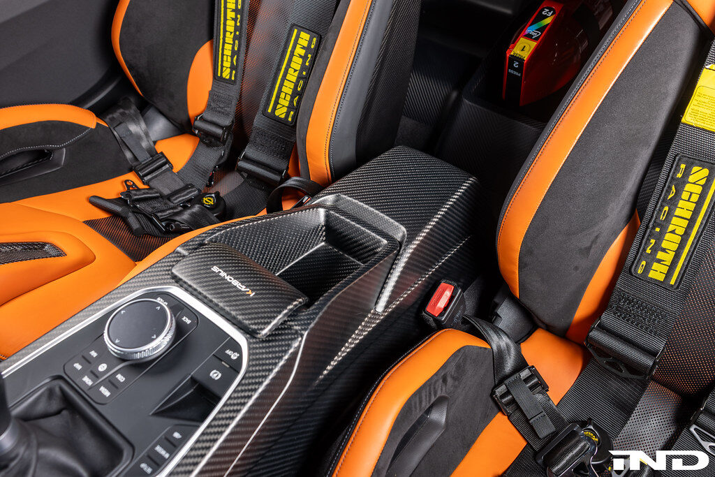 carbon fiber center console armrest shift surround karbonius ind distribution m3list m3parts bmw g80 m3 g82 m4 g83 m4 g87 m2 pricing price cost for sale interior modifications mods g8xm3 g8xm4 g8xm2