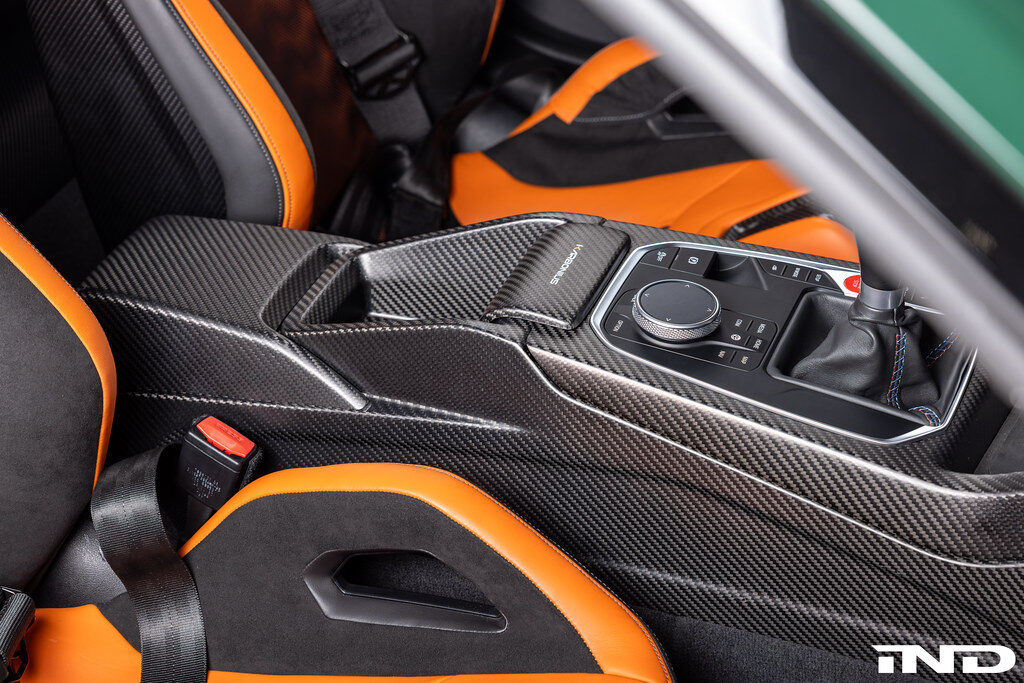 carbon fiber center console armrest shift surround karbonius ind distribution m3list m3parts bmw g80 m3 g82 m4 g83 m4 g87 m2 pricing price cost for sale interior modifications mods g8xm3 g8xm4 g8xm2
