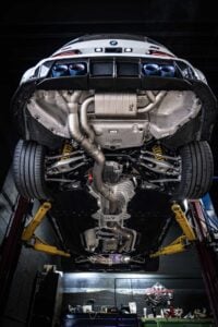 irl llc exhaust valved bmw g80 m3 g82 m4 g8x discount code for irlllc underside undercarriage on lift